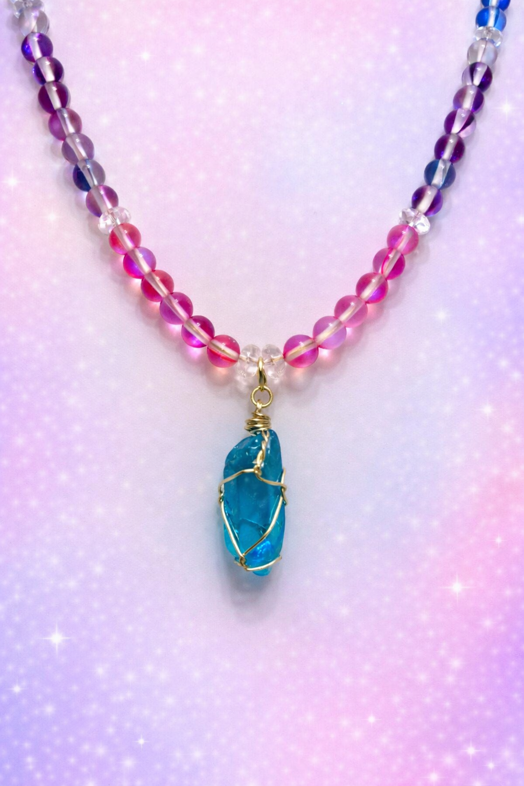 Aura quartz gemstone necklace with Aqua wrapped pendant